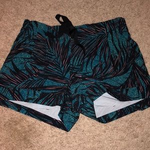 Teal, black, and orange lululemon shorts.